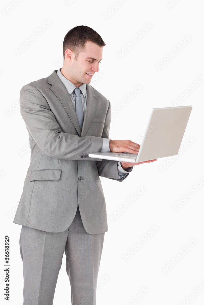 Portrait of a young businessman working with a laptop Portrait of a young businessman working with a laptop