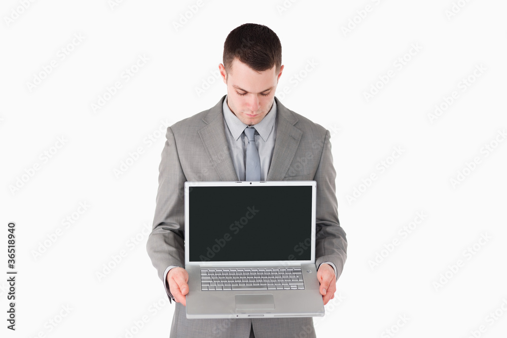 Businessman showing a laptop Businessman showing a laptop
