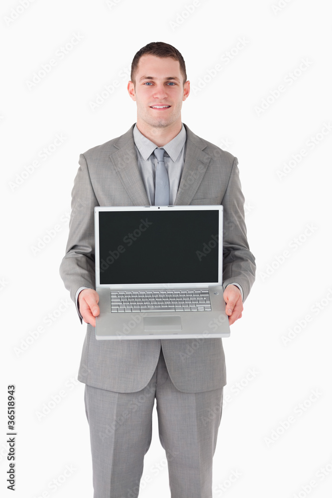 Portrait of a businessman showing a laptop Portrait of a businessman showing a laptop