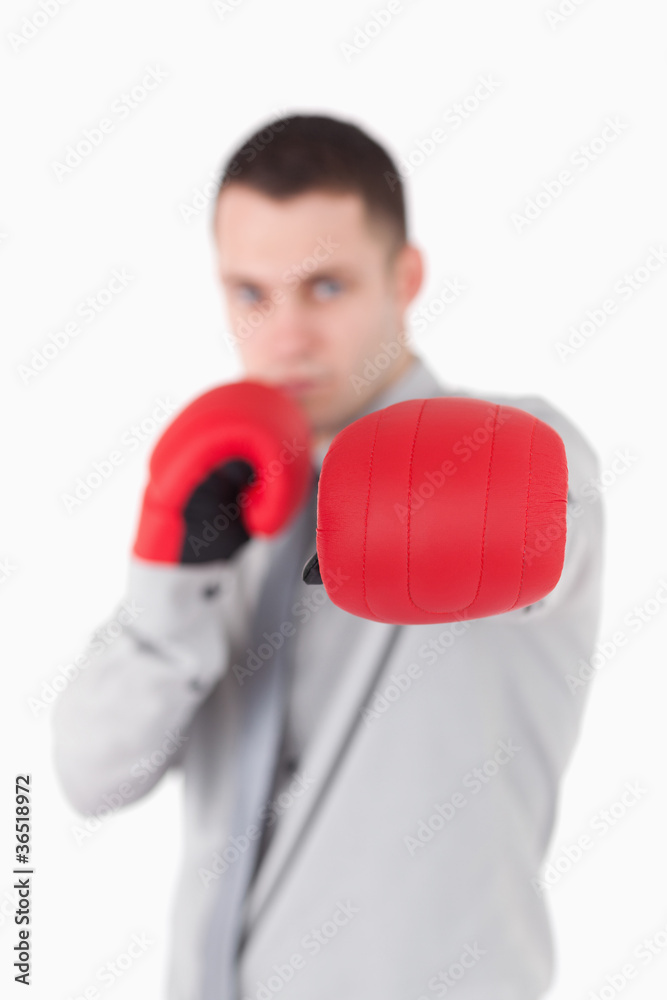 Portrait of a businessman wearing boxing gloves Portrait of a businessman wearing boxing gloves
