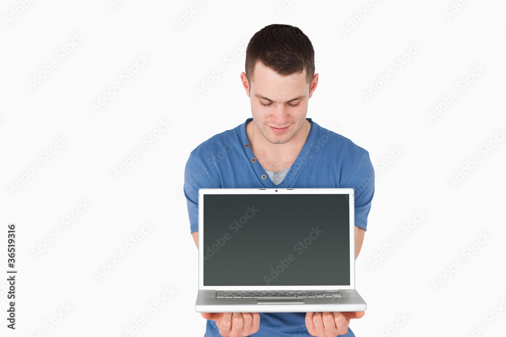 Man looking at a laptop Man looking at a laptop