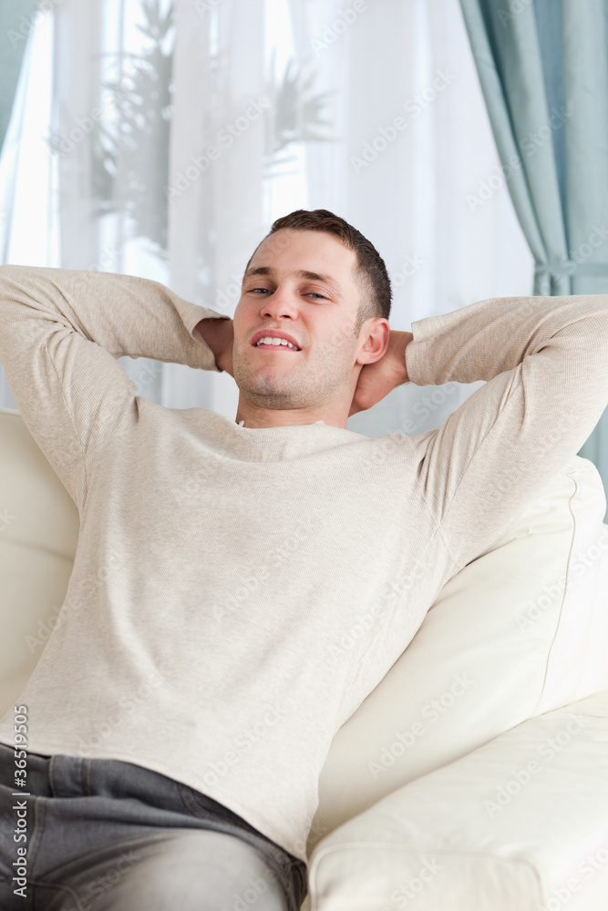 Portrait of a man relaxing on a sofa