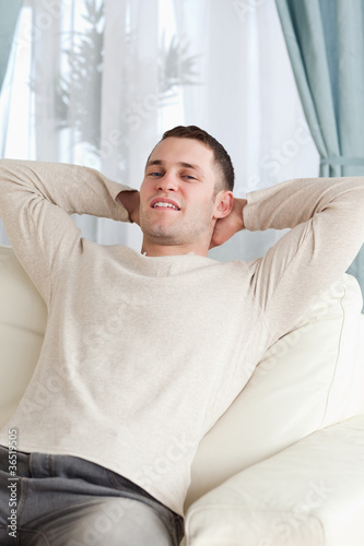 Portrait of a man relaxing on a sofa