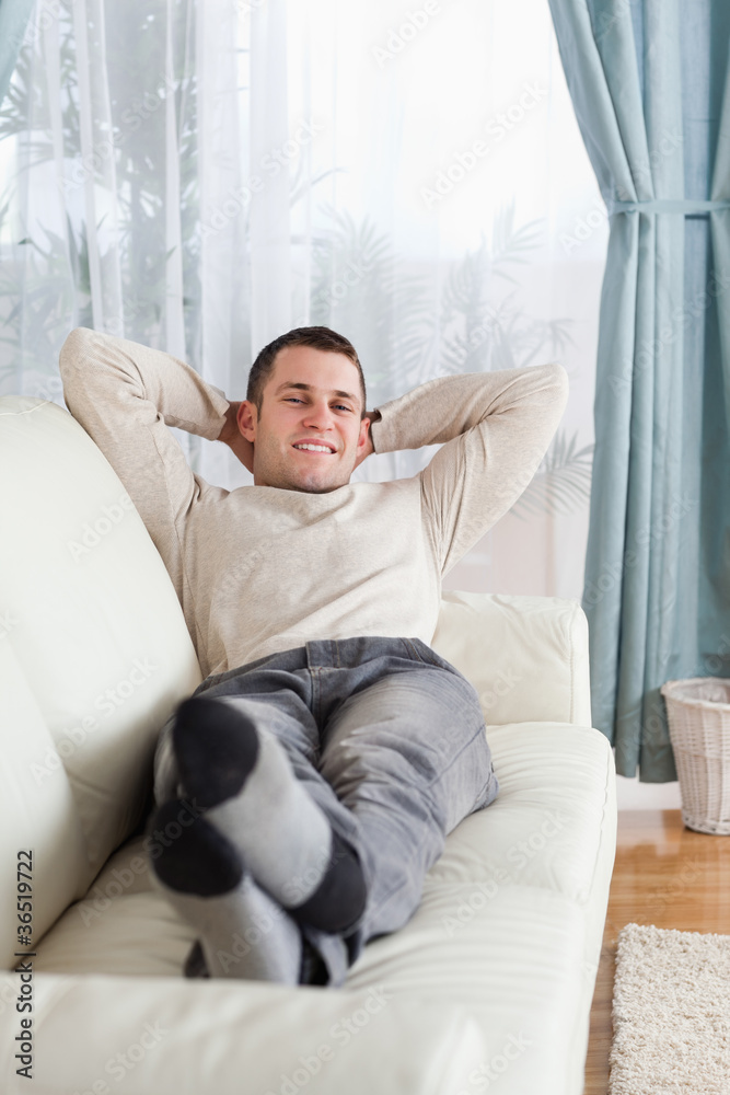Portrait of man lying on a sofa Portrait of man lying on a sofa
