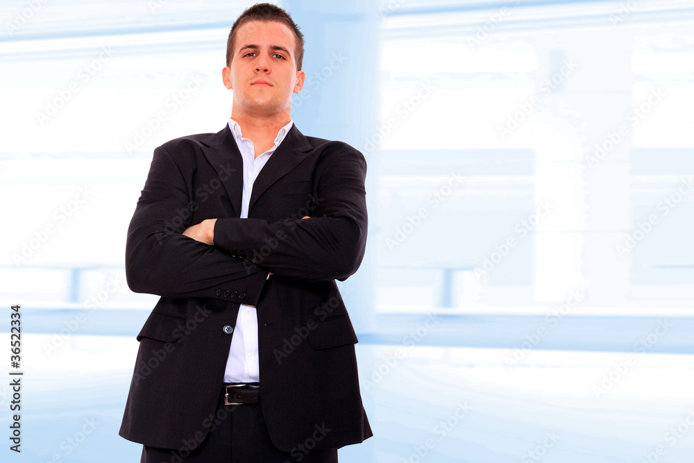 Closeup of a young smiling business man standing Closeup of a young smiling business man standing