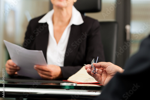 Female Lawyer or notary in her office