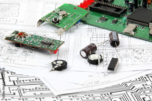 Electronic circuit boards on the background of electronic scheme