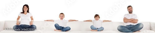 Family Sitting on White Couch