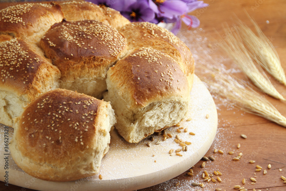 Fresh sesame bread over a wooden table Fresh sesame bread over a wooden table