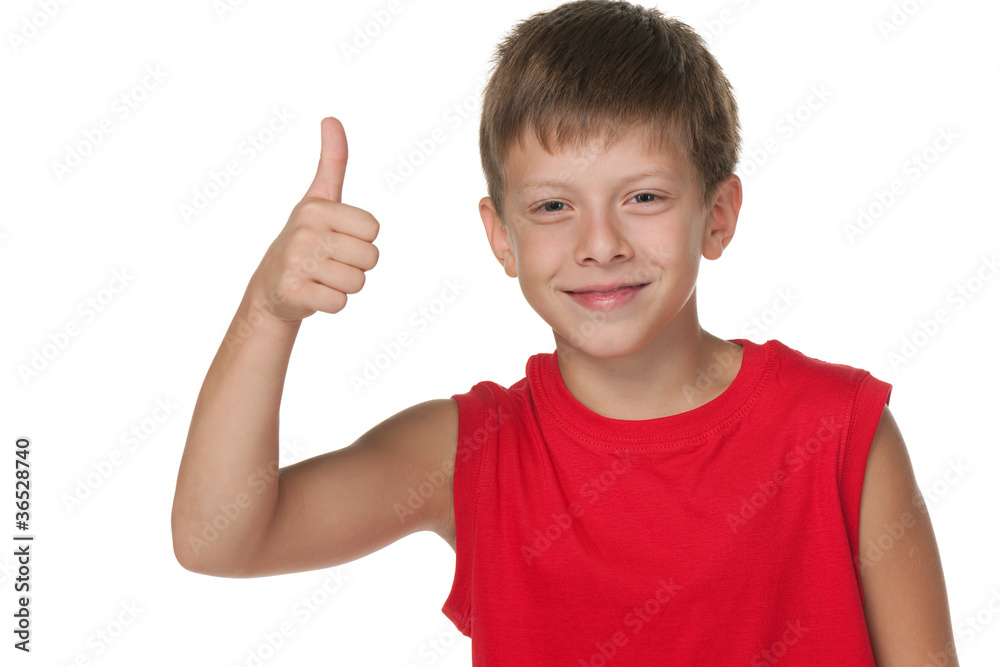 Smiling boy demonstrates thumb up Smiling boy demonstrates thumb up