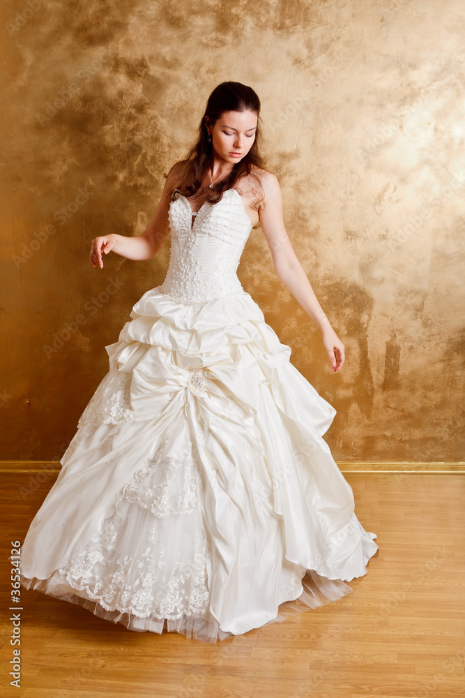Beautiful dark haired woman in white bridal dress Beautiful dark haired woman in white bridal dress