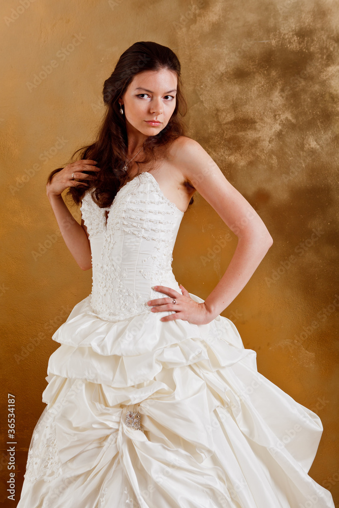 Beautiful dark haired woman in white bridal dress Beautiful dark haired woman in white bridal dress