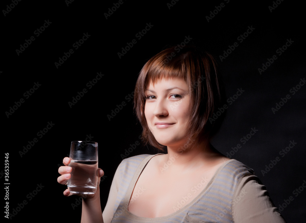 young woman with glass water, black background young woman with glass water, black background