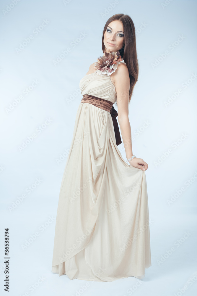 Beautiful woman with modern dress posing in studio