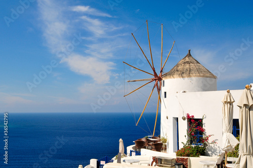 Old windmill in Santorini overlooking the sea