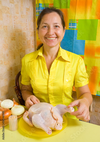woman sewed stuffed chicken photo