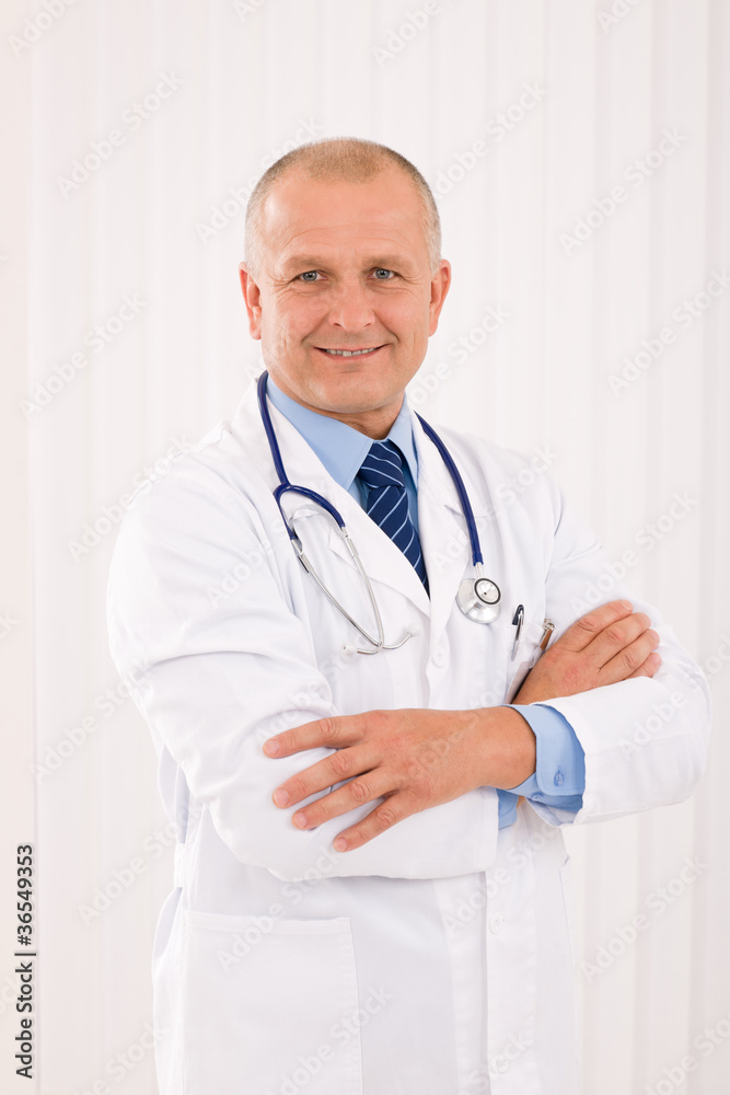 Mature doctor male with stethoscope cross arms Mature doctor male with stethoscope cross arms