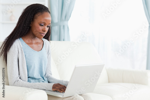 Woman typing on her laptop