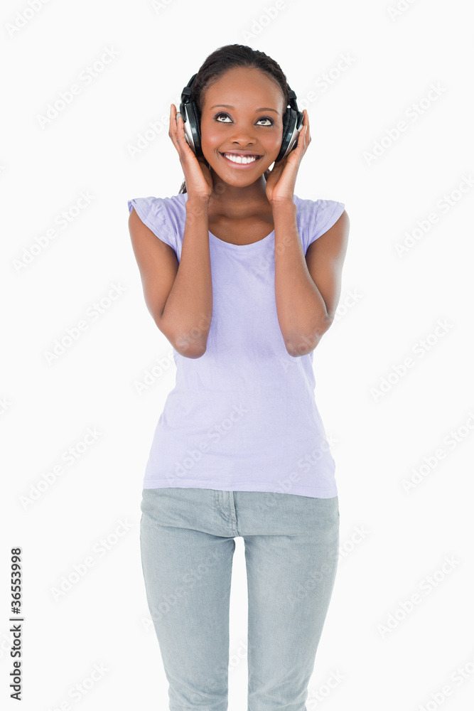 Close up of happy woman enjoying music on white background Close up of happy woman enjoying music on white background