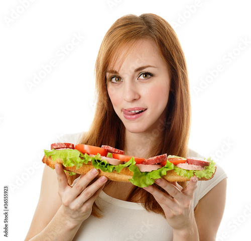 Young woman eating fast food. isolated on white