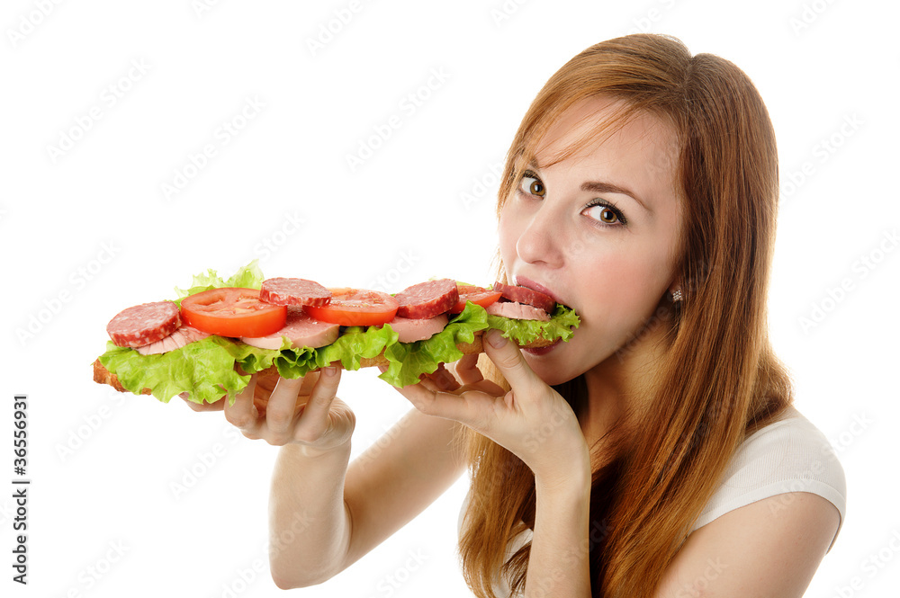 Young woman eating fast food. isolated on white Young woman eating fast food. isolated on white