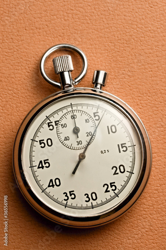 Stopwatch isolated on the paper background