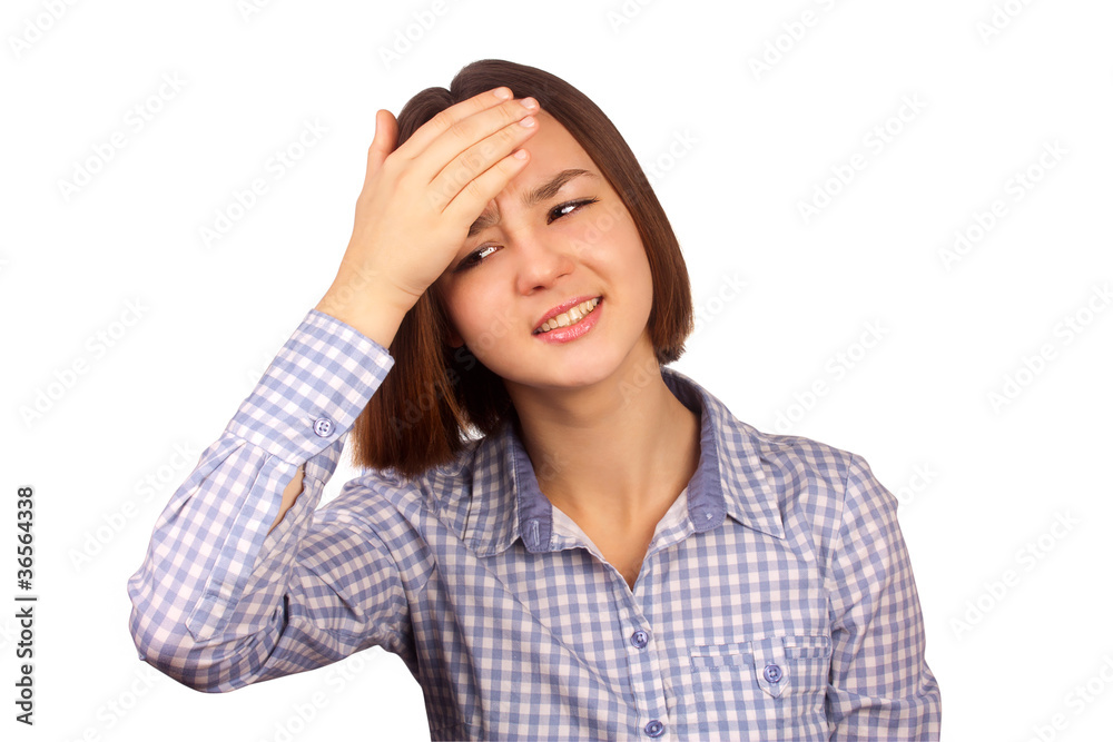Young woman with a headache holding her hand to the head Young woman with a headache holding her hand to the head