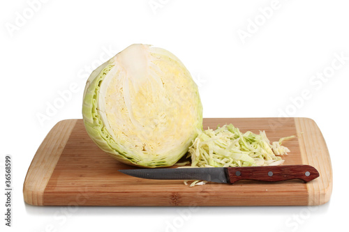 green cabbage shredded on wooden board isolated on white