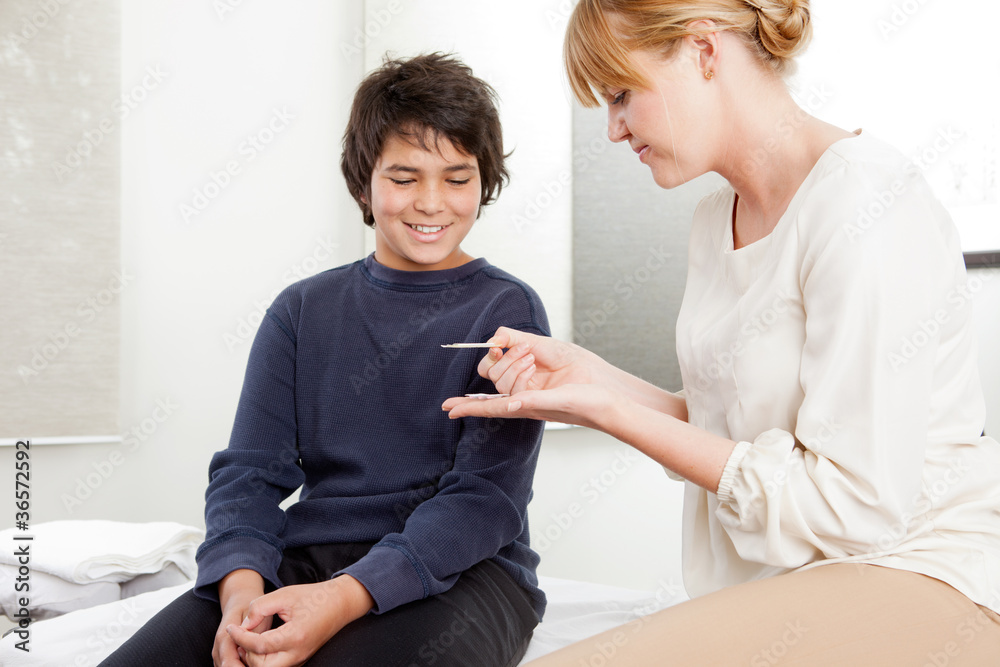 Fototapeta premium Acupuncturist With Young Male Patient