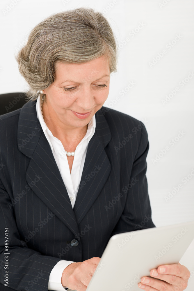 Senior businesswoman touch-screen tablet computer Senior businesswoman touch-screen tablet computer