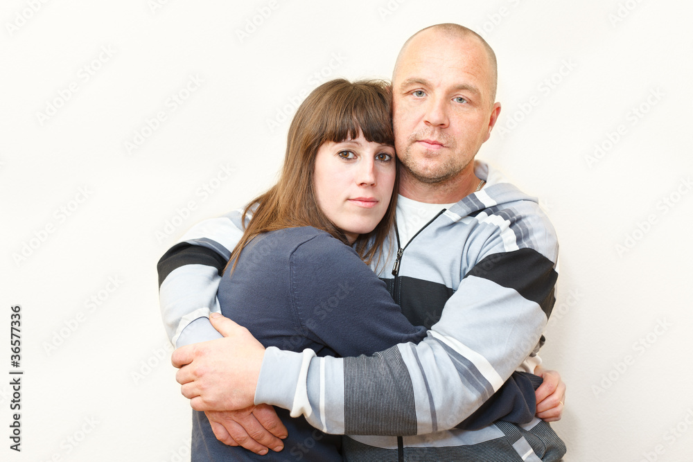 Man and woman a loving couple embracing together Man and woman a loving couple embracing together