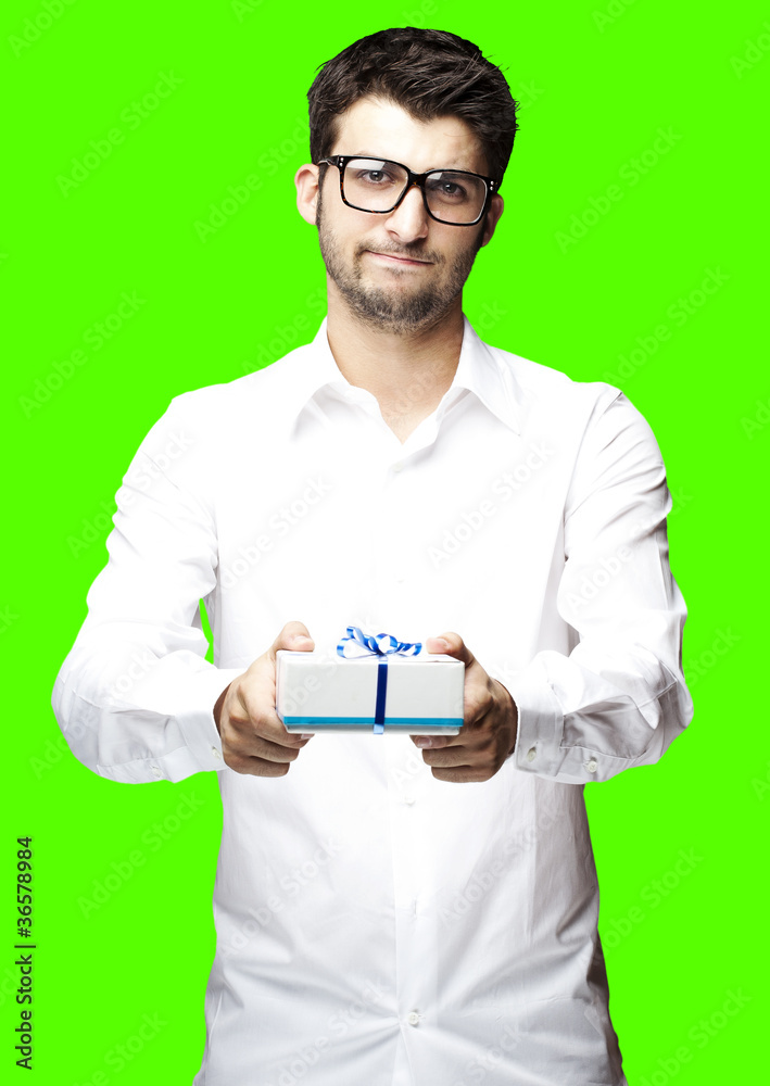 man giving gift over removable chroma key background
