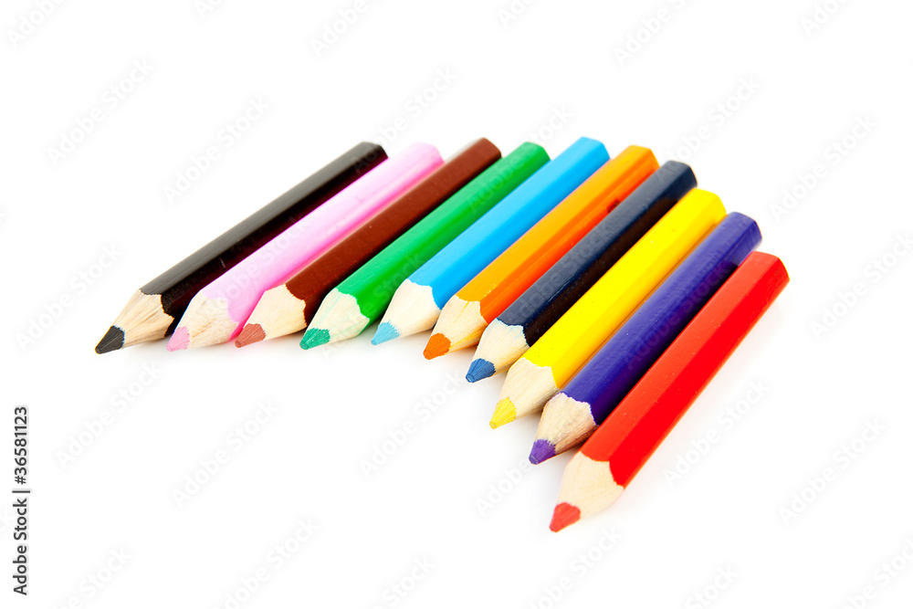 colorful pencils in a row over white background colorful pencils in a row over white background