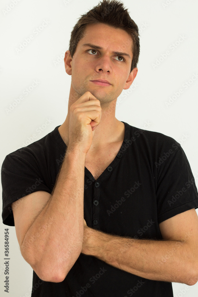 Man thinking with hand on face Man thinking with hand on face