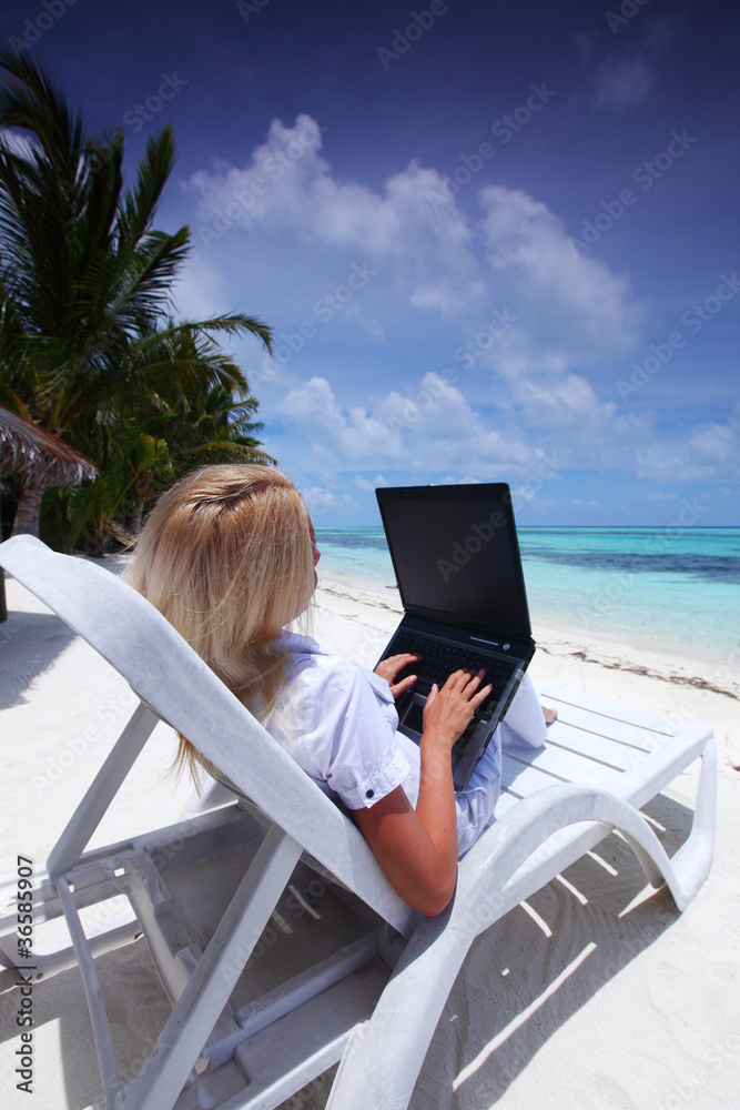tropical business woman with laptop