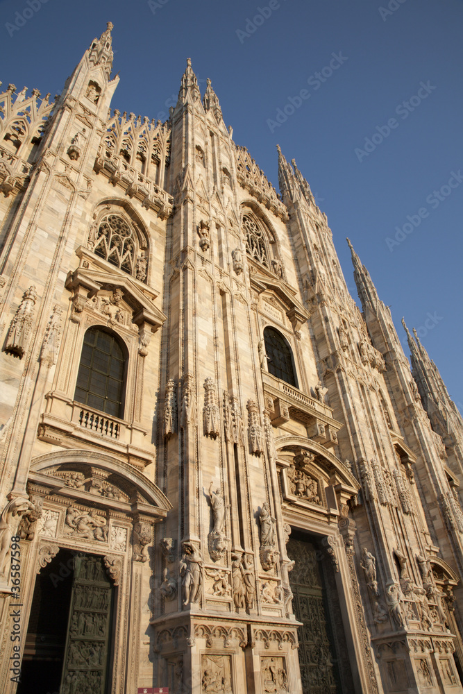 Milan - westfacade of cathedral in evening light