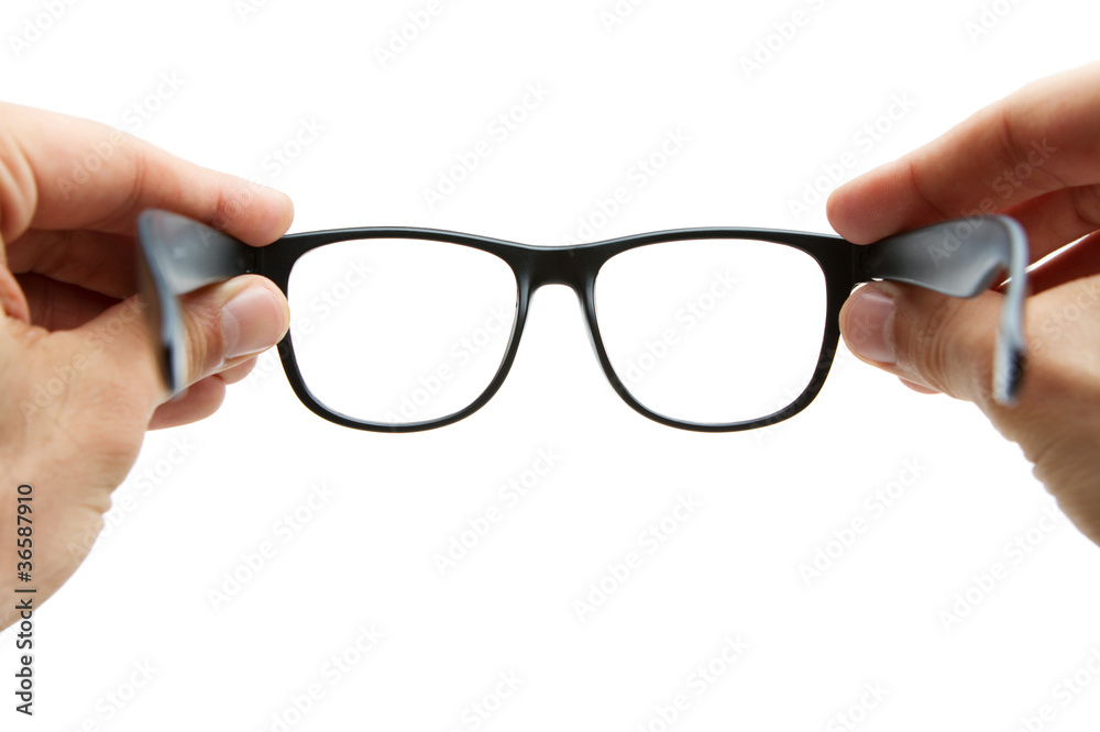Human hands holding retro style eyeglasses Stock Photo | Adobe Stock