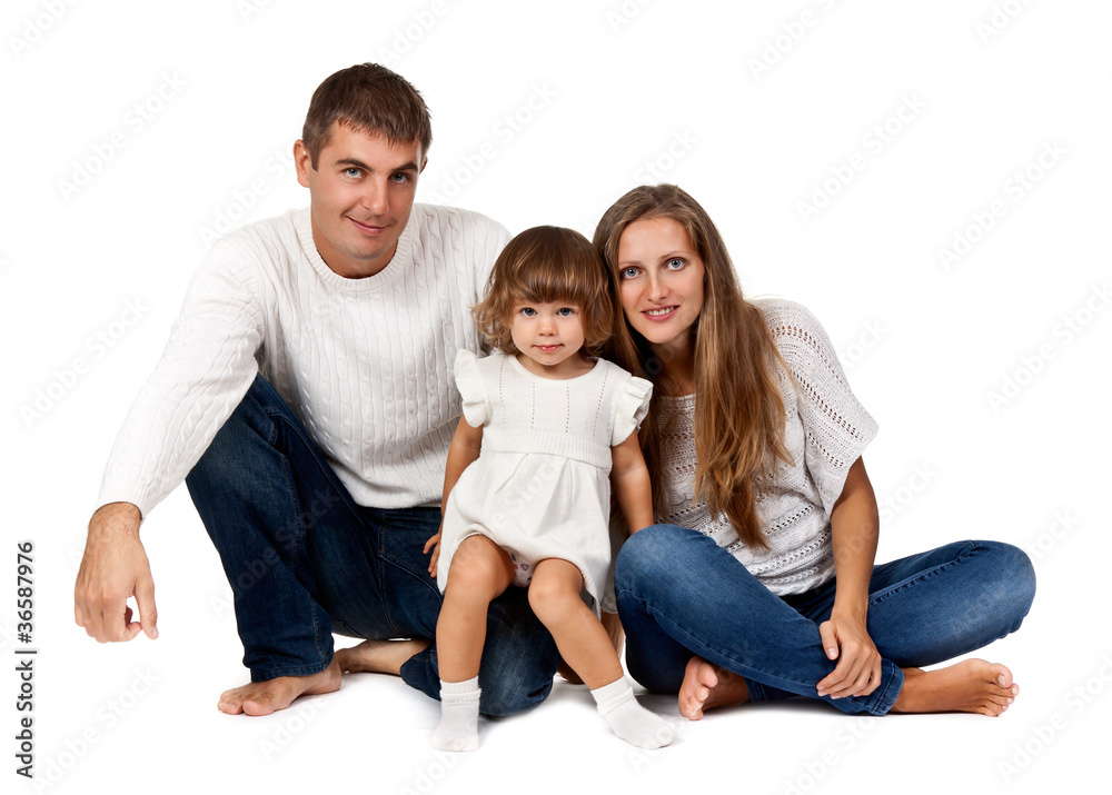 happy family sitting in the studio