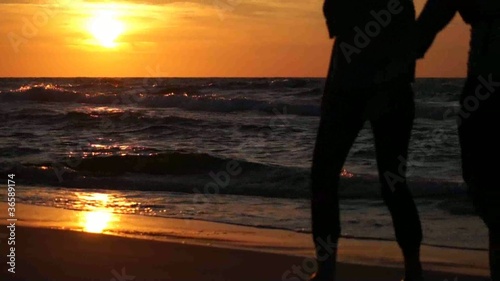 Nordicwalking Schattenriss am Strand & Sonnenuntergang