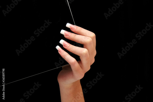 Human fingers with long fingernail and beautiful manicure