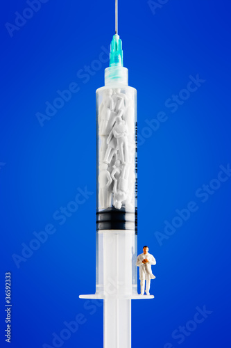 figurines placed inside syringe.