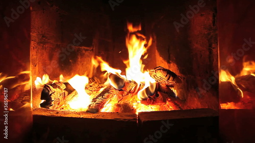 the dying embers in the fireplace