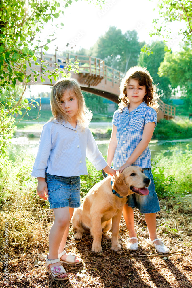 kid girls with Golden retriever puppy outdoor kid girls with Golden retriever puppy outdoor
