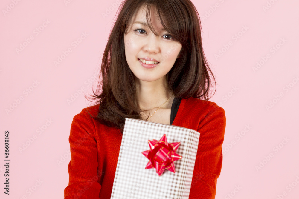 Fototapeta premium Beautiful young woman with gift
