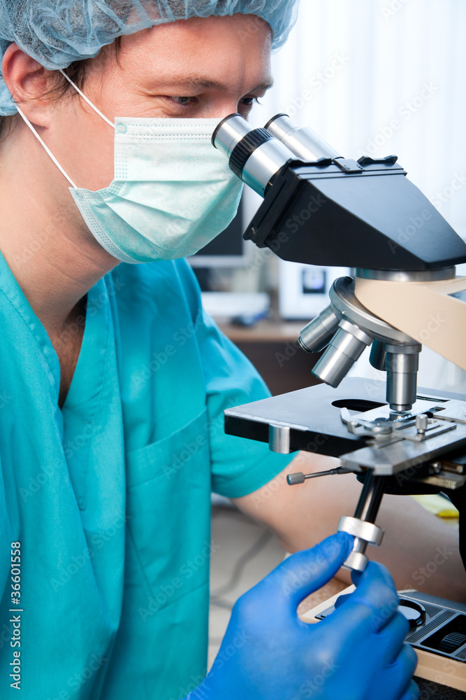 researcher with microscope researcher with microscope