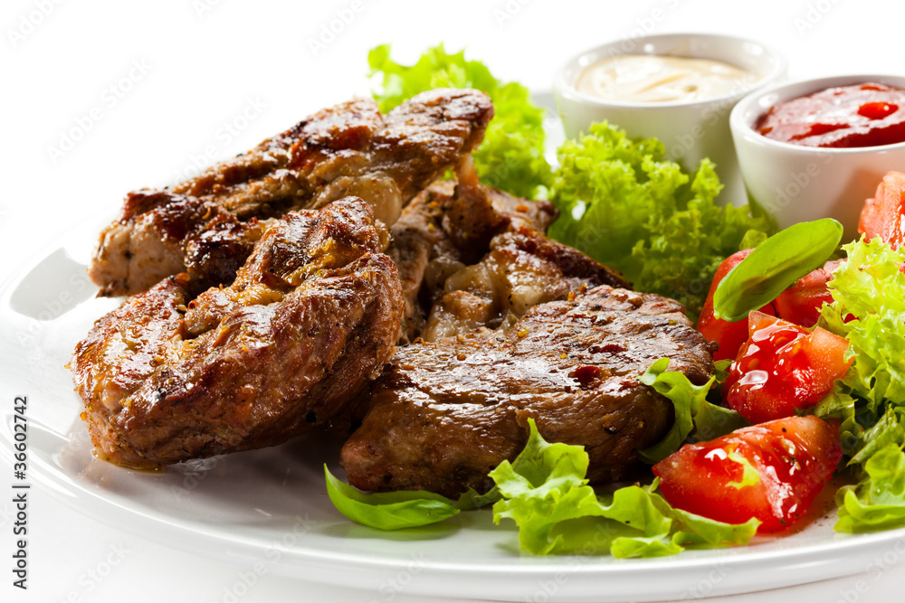 Grilled steaks and vegetables