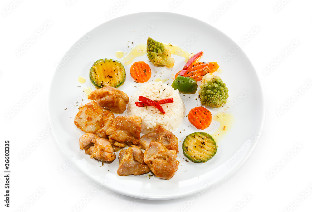 Fried chicken nuggets, white rice and vegetables Fried chicken nuggets, white rice and vegetables
