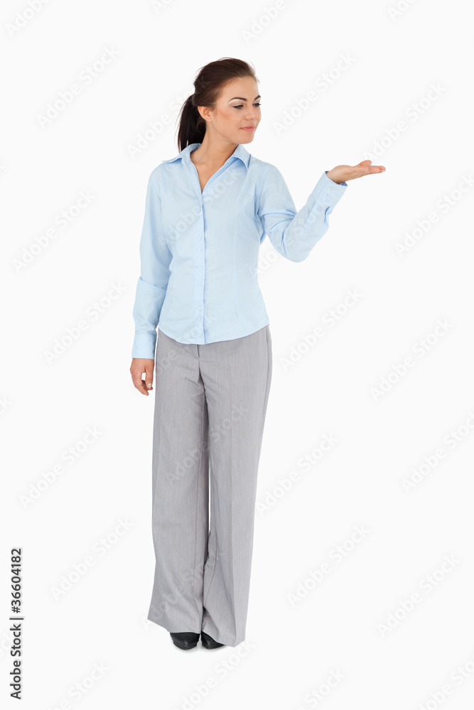 Businesswoman looking at what she is presenting Businesswoman looking at what she is presenting