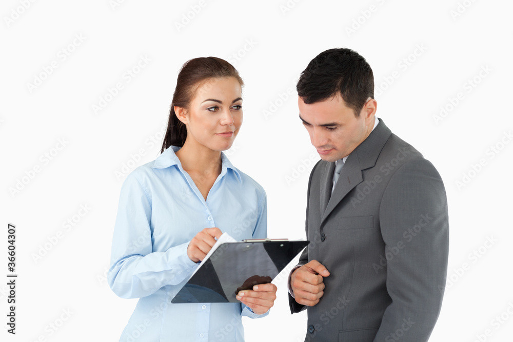 Businesswoman explaining data to her partner Businesswoman explaining data to her partner