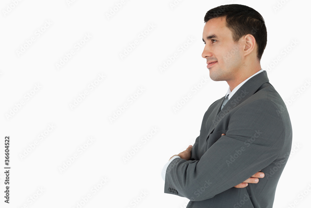 Side view of confident businessman with arms folded Side view of confident businessman with arms folded